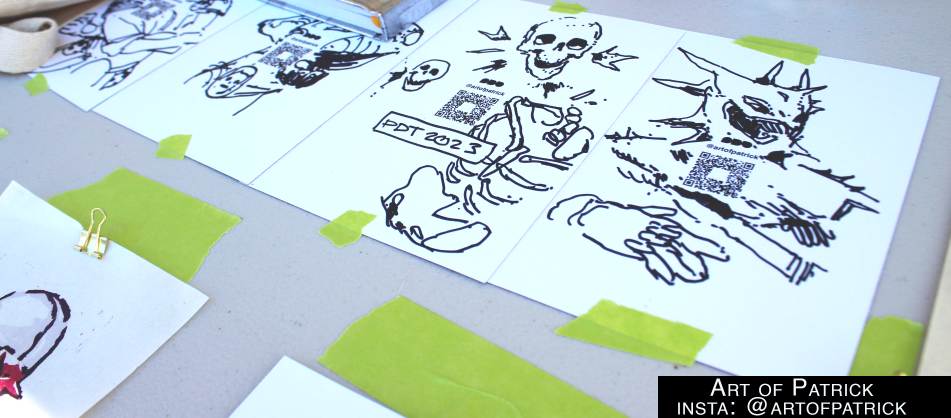 Close up of the gun and skull drawings and sketches in ink.