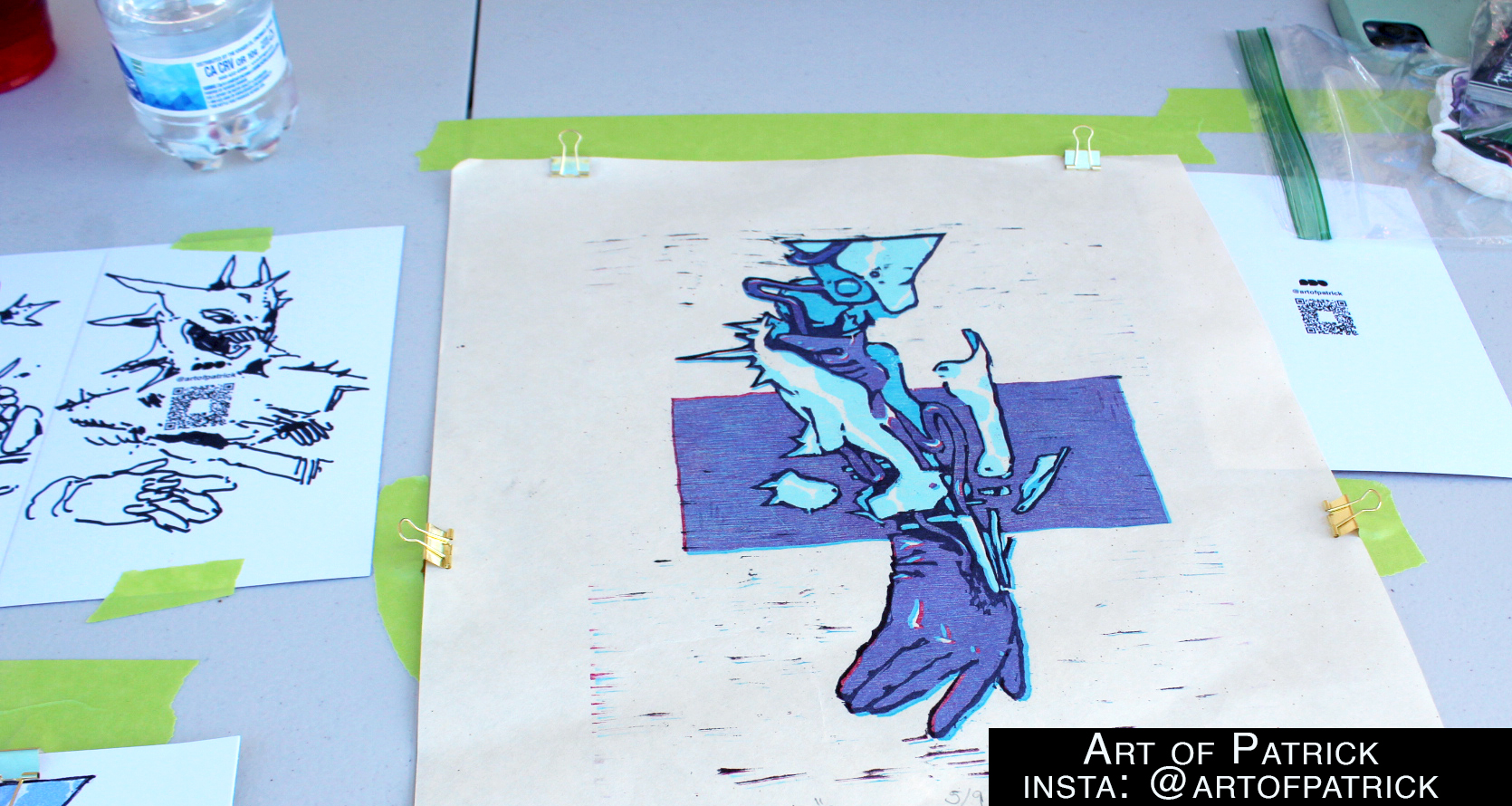 Close up of the repairs needed broken arm in a different screenprinting setup with blues and cyans. 